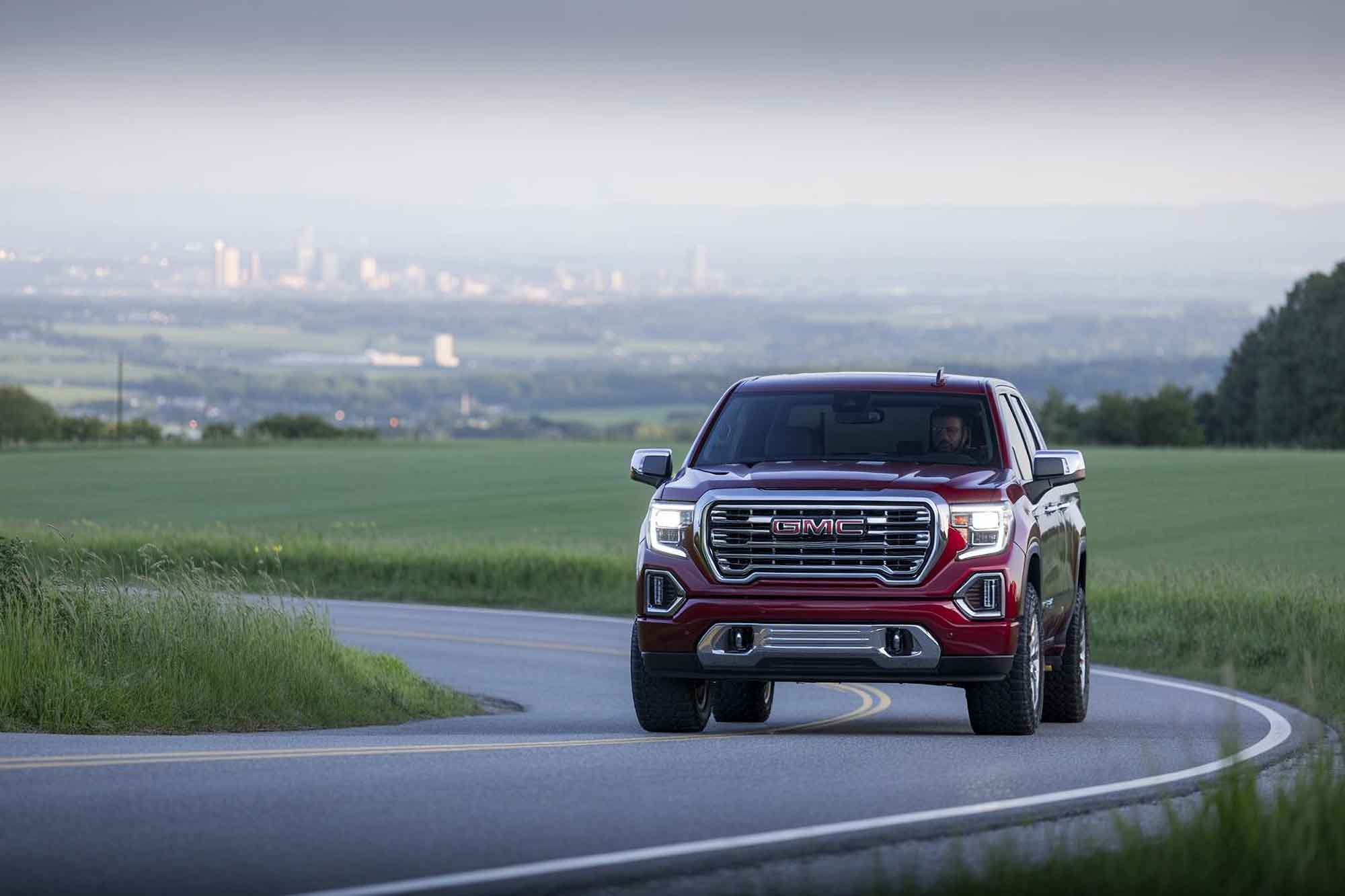 auto body shop 6 truck going down road